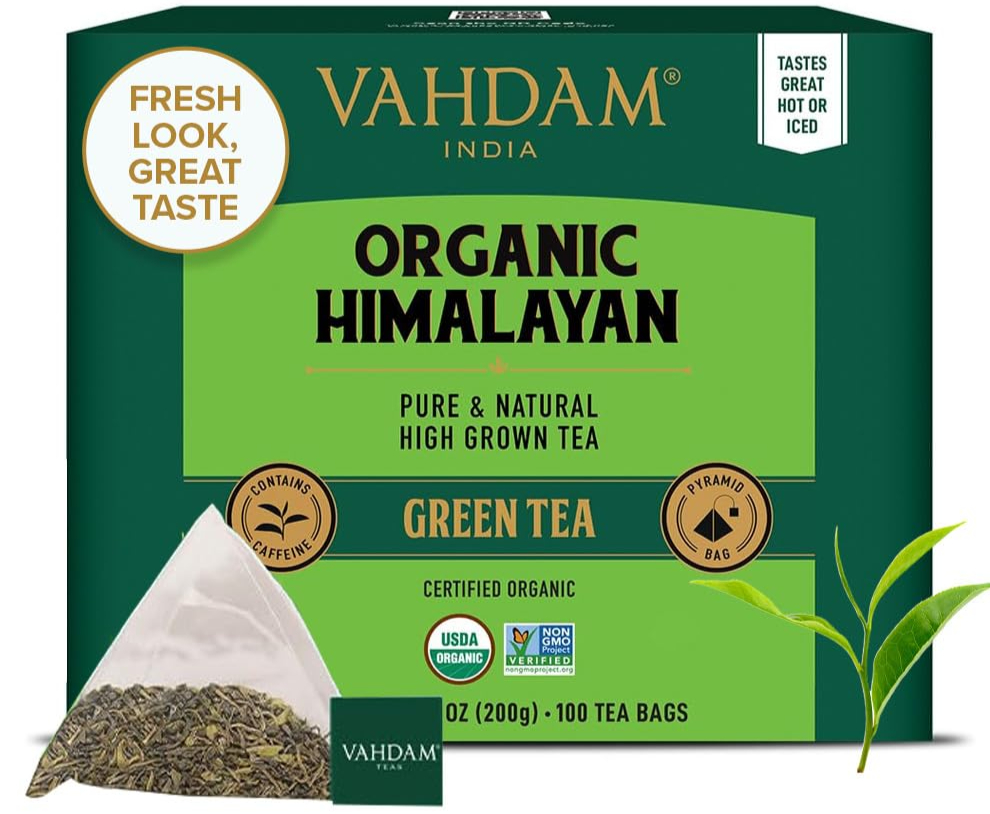 Vahdam Organic Himalayan Green Tea box with pyramid tea bag and green leaves.